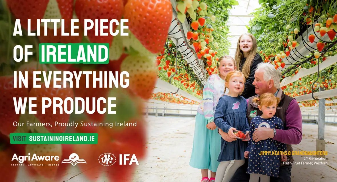 Public campaign poster for AgriAware showing a fruit farmer with his grandkids inside their farm in Wexford and the tagline A LITTLE PIECE OF IRELAND IN EVERYTHING WE PRODUCE