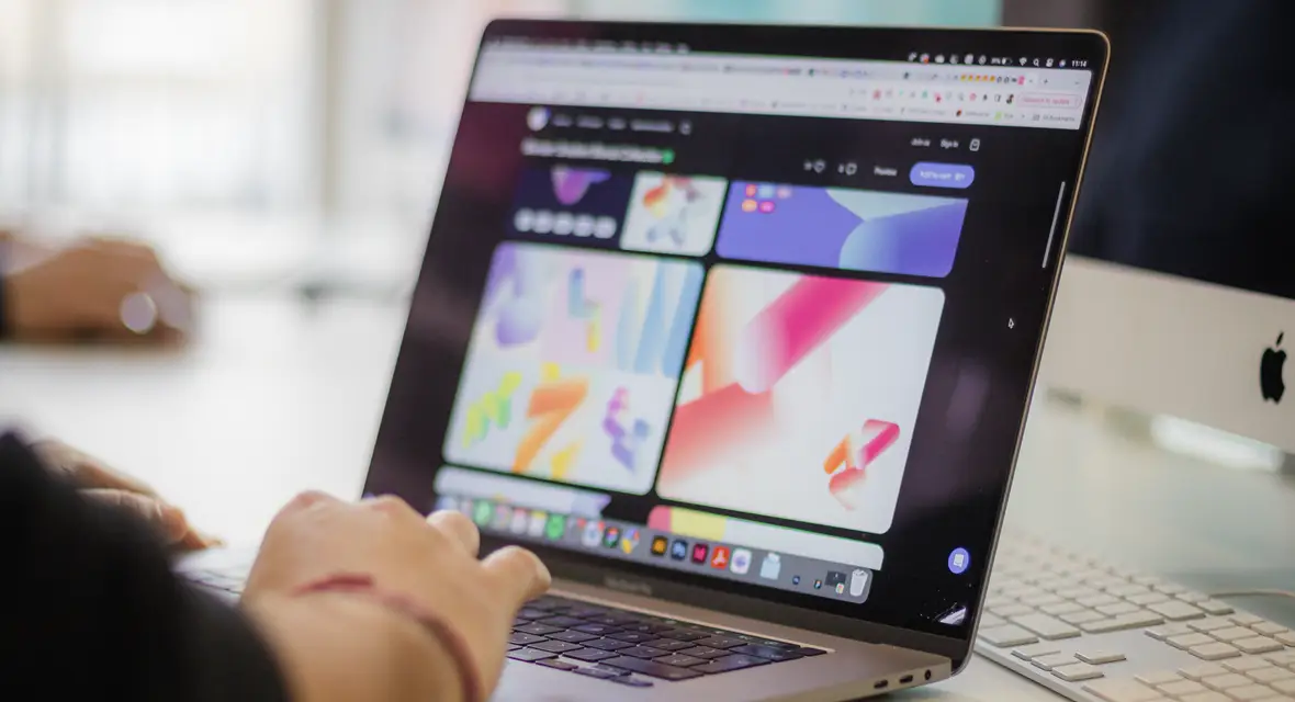 Zoomed in images of hands typing on a laptop keyboard